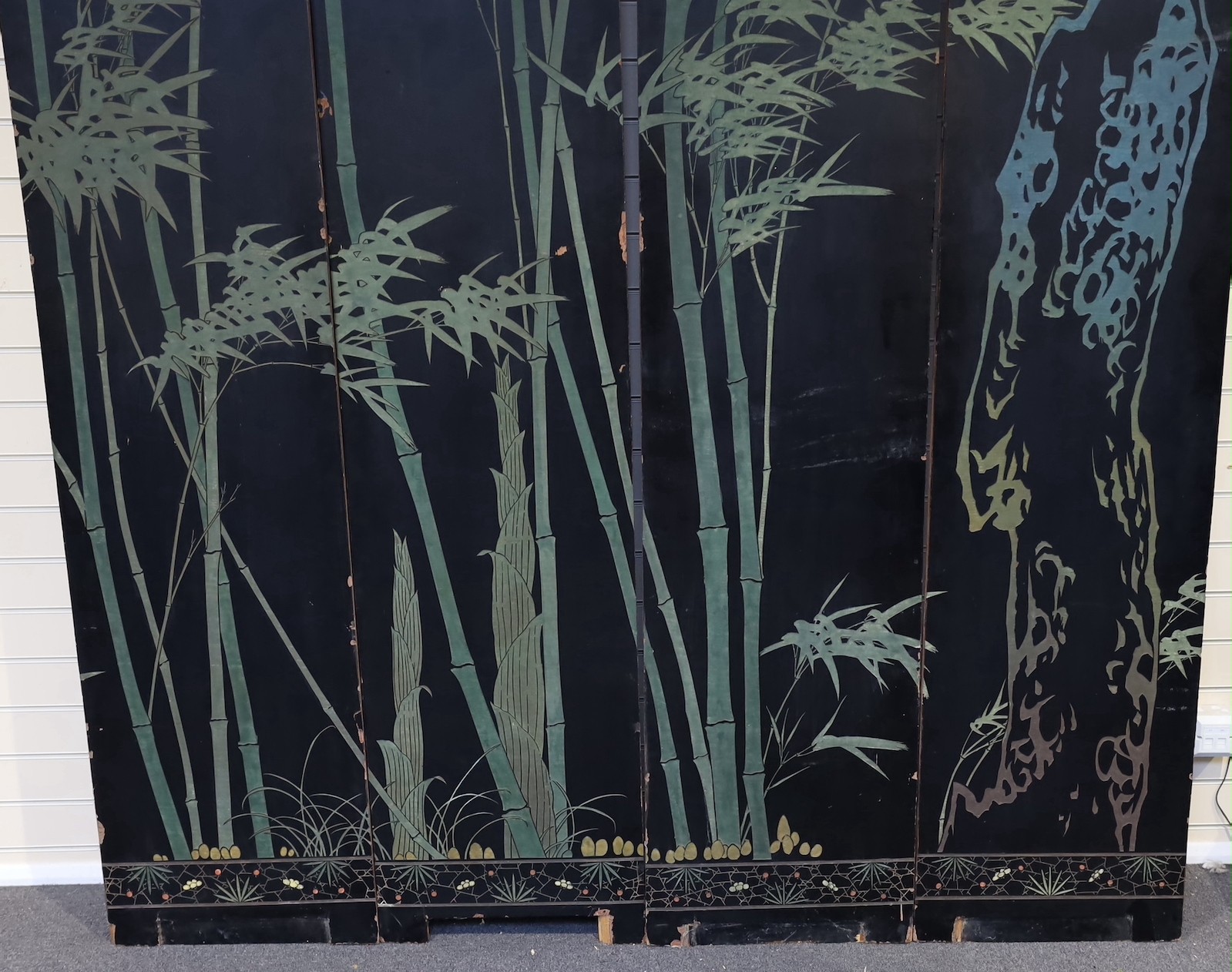 A tall Chinese coromandel lacquer twelve panel screen, 19th century, each leaf panel width 49cm, height 264cm